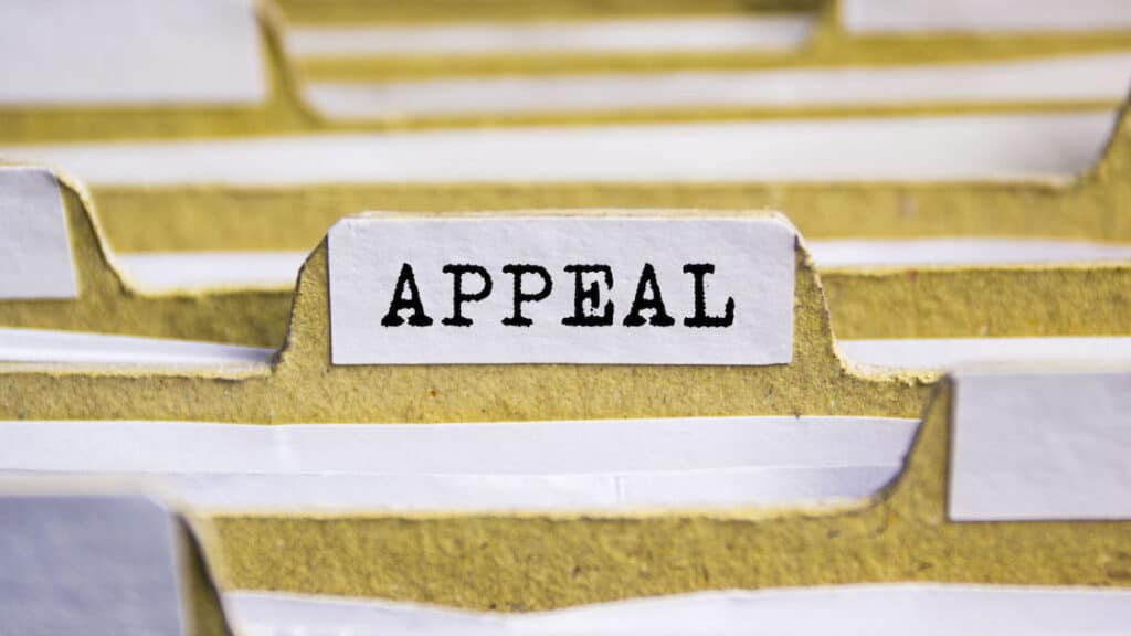 A paper folder labeled with the word “appeal.”