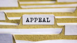 A paper folder labeled with the word “appeal.”
