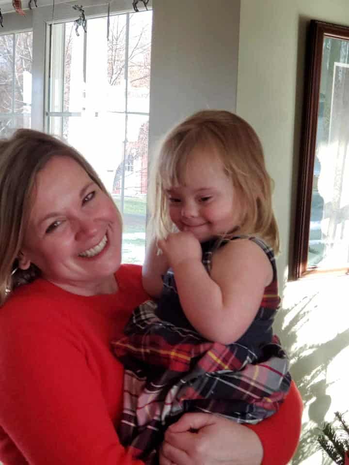 Mother and daughter smiling together.