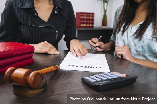 A mom and her lawyer prepare paperwork for a continuing tutorship
